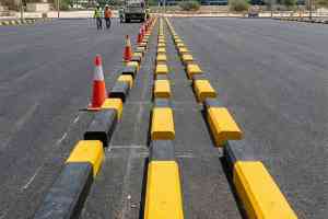 Precast concrete wheel stopper installed in a UAE car park bay