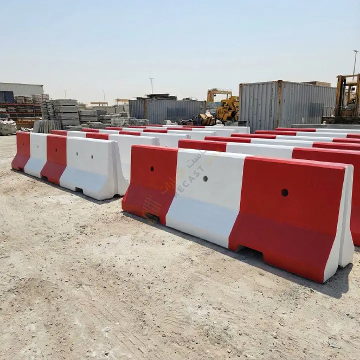 Matte finish concrete barriers in red and white safety paint
